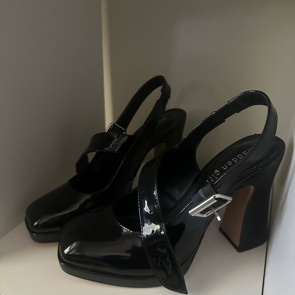 Black shiny madden-girl close-toed buckle heels